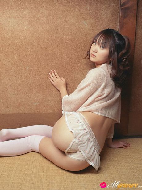 Sexy gravure idol in stripped black and white stockings