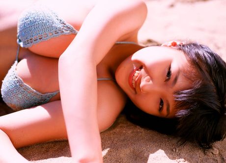 Gravure idol Ai showing off her huge melons in little red bikini