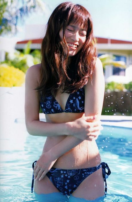 Beautiful gravure idol dressed in a bright and colorful kimono