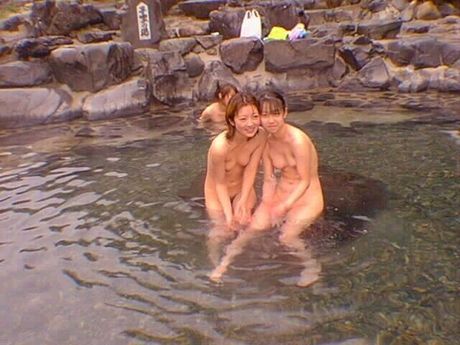 Asian amateur girl shows her hairy cunt and small tits in a public pool