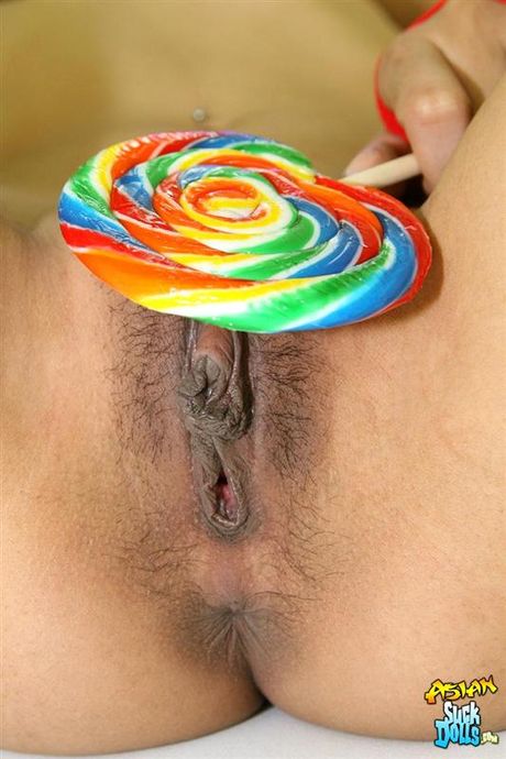 Sweet looking thai in school girl outfit sucks lolipop