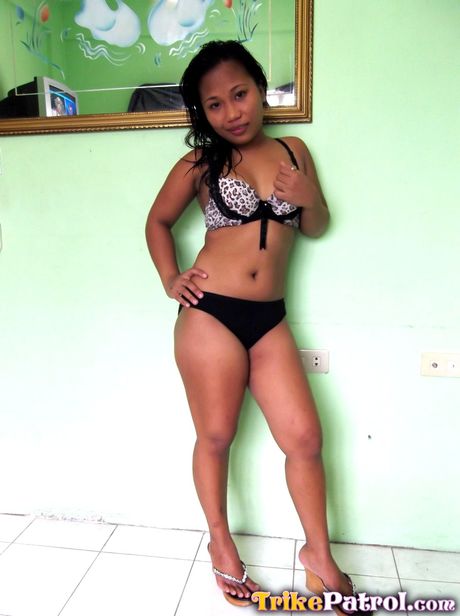 Asian babe Jo Ann strips and shows her tiny tits and shaved pussy