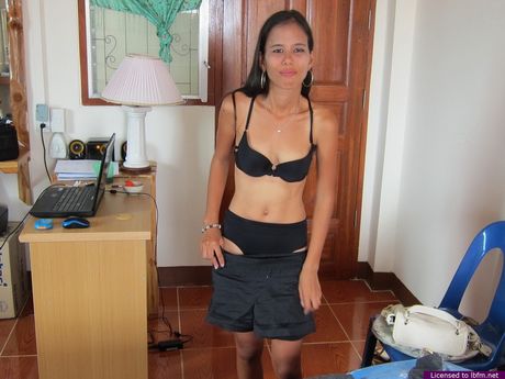 Skinny Asian teen strips and bares her tiny tits and pussy