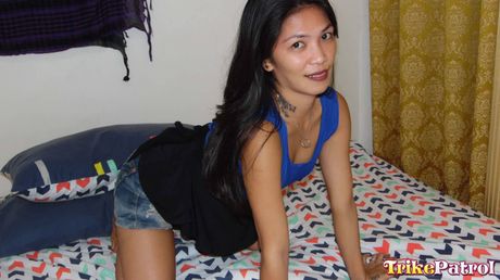 Asian teen Sazkhia strips and shows her hairy pussy in the shower