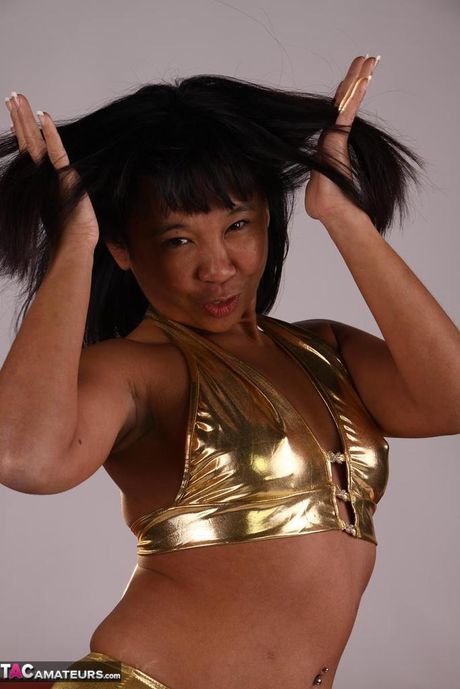 Asian babe Melissa shows her hot booty and tits in a solo striptease