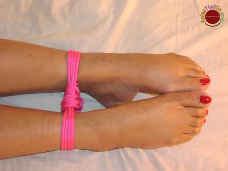 Asian amateur woman strips and bares her tiny tits and pussy