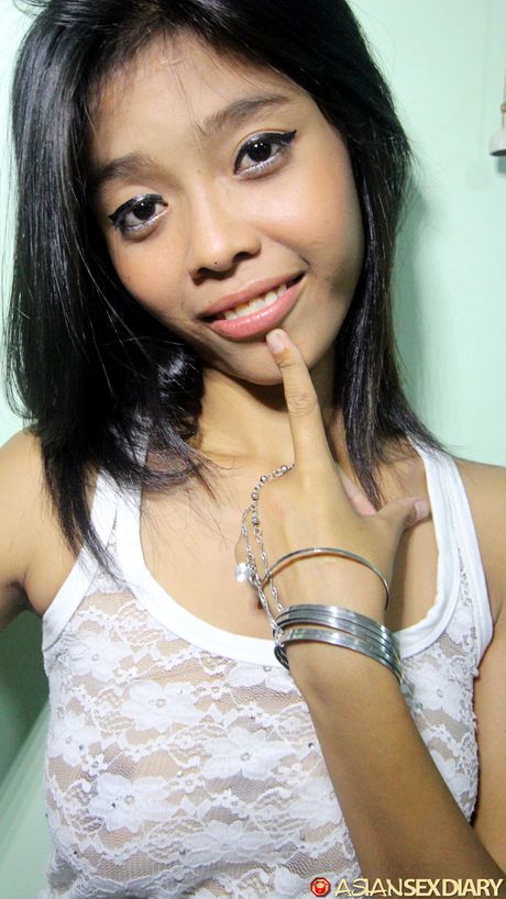 Skinny Asian teen amateur girl toying her hairy pussy and fucking it with a dildo