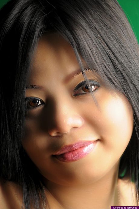 Japanese teen strips off and reveals her hairy pussy up close